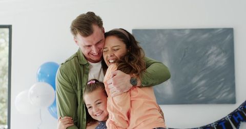 Joyful Family Celebrating with Hugs and Laughter