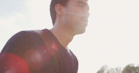 Man Enjoying Nature Walk on Sunny Day
