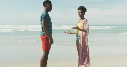 Couple Arguing on Beach During Vacation