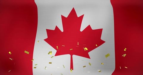 Canadian flag with gold confetti celebrating canada day and national pride red maple leaf