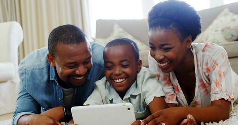 Joyful Family Bonding with Tablet Technology at Home - Download Free Stock Images Pikwizard.com