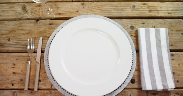 Rustic Table Setting with Empty Plate, Napkin, and Cutlery - Download Free Stock Images Pikwizard.com