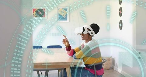 Woman Engaging with Virtual Reality Interface in Modern Dining Room
