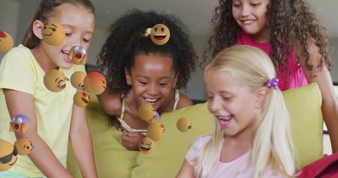 Diverse Schoolgirls Engaging with Interactive Technology and Emojis - Download Free Stock Images Pikwizard.com