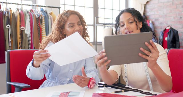 Female Fashion Designers Reviewing Digital Designs on Tablet in Office - Download Free Stock Images Pikwizard.com