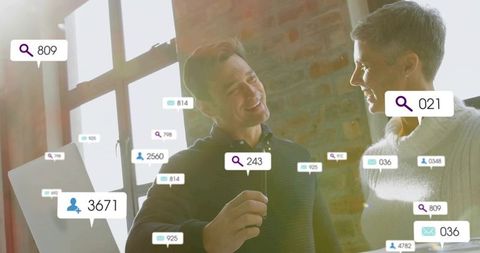 Young coworkers discussing social media metrics overlay in sunlit loft office for teamwork