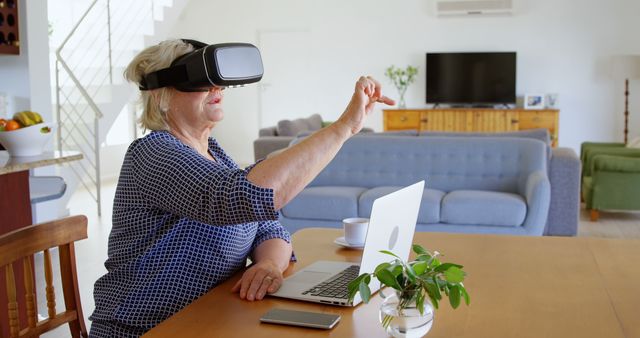 Elderly Woman Using Virtual Reality Headset in Modern Living Room - Download Free Stock Images Pikwizard.com
