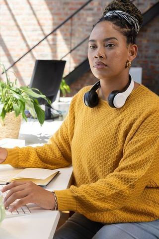 Focused Professional Woman Working at Modern Office Desk
