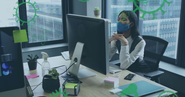 Image of virus icons over businesswoman with face mask using computer in office - Download Free Stock Photos Pikwizard.com
