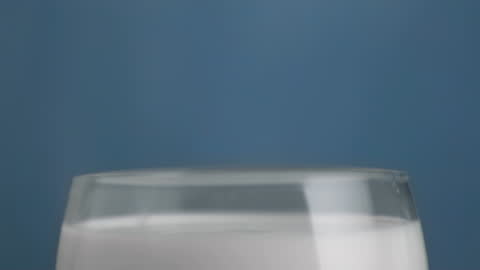 Milk Drop Captured in Glass Slow Motion