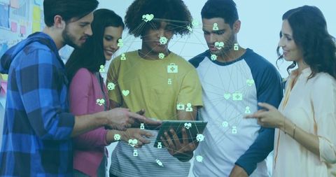 Diverse Team Collaborating on Tablet with Network Icons Visualization
