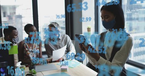 Diverse Professionals Working with Digital Financial Data in Office