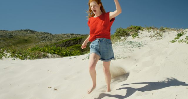 Joyful Woman Running on Sandy Beach on a Sunny Day - Download Free Stock Images Pikwizard.com