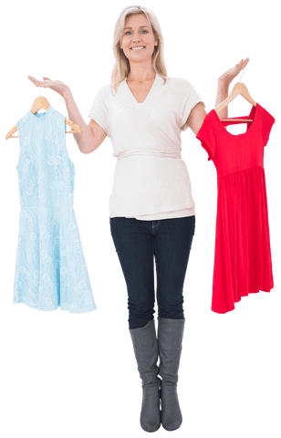 Smiling blonde woman balancing two dresses on transparent background