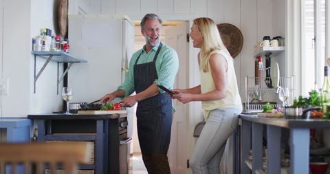 Happy Couple Cooking Together at Home