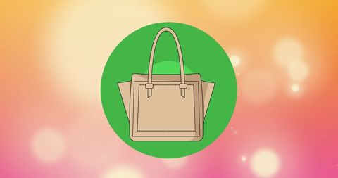 Beige tote handbag on green and pink bokeh background