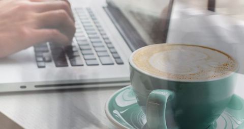 Caucasian Woman Typing on Laptop with Latte in Foreground - Download Free Stock Images Pikwizard.com