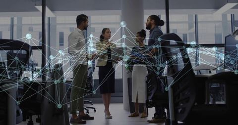 Professionals Connect in Open-Plan Office for Innovation and Teamwork