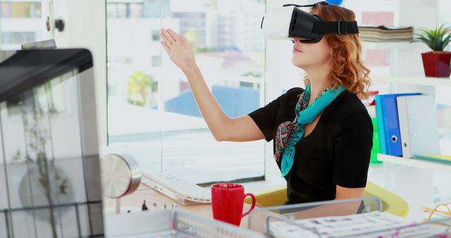 A woman in an office setting wearing a VR headset, interacting with virtual objects. This image is ideal for illustrating modern technology in the workplace, innovation in business settings, and the integration of immersive virtual reality experiences in professional environments. It can be used for articles on digital transformation, remote work trends, tech advancements in business, and productivity tools.