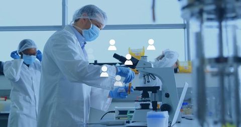 Scientists conducting experiments in advanced laboratory environment