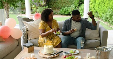 Couple Celebrating with Dessert on Relaxing Outdoor Patio