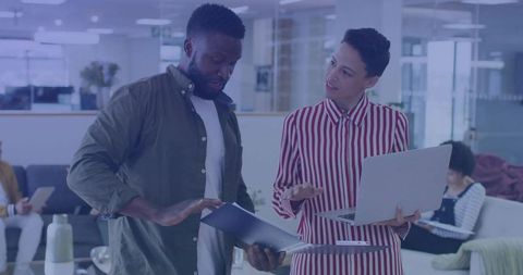 Collaborative Office Work Discussing Reports Laptops