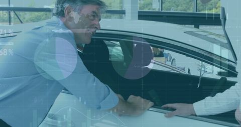 Man Inspecting Car at Dealership Discussing Features - Download Free Stock Images Pikwizard.com