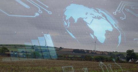 Rural wind energy concept with harvested field, wind turbines and digital globe overlay