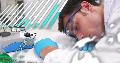 Exhausted lab technician resting head on bench wearing goggles, nitrile gloves, lab coat