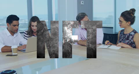 Team Discussing NFTs in Modern Office Setting