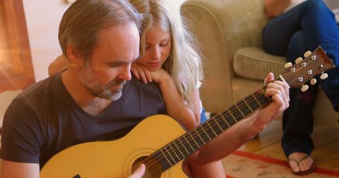 Father and Daughter Bonding Over Guitar at Home - Download Free Stock Images Pikwizard.com