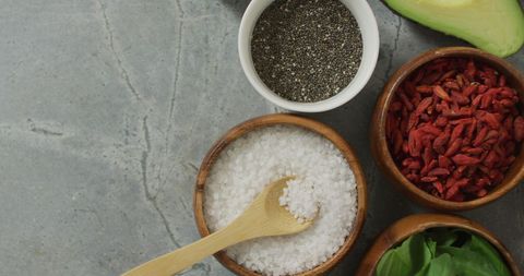 Healthy Ingredients like Goji Berries and Salt on Stone Kitchen Counter - Download Free Stock Images Pikwizard.com
