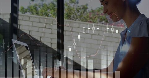 Caucasian Businesswoman Working with Touchscreen and Financial Graphs