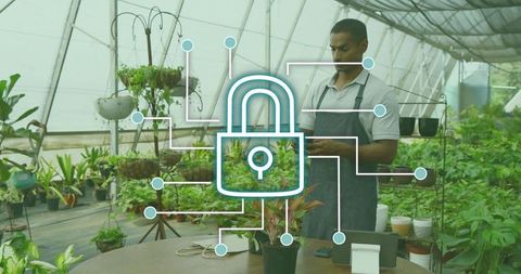 Greenhouse worker updating plant data on tablet with cybersecurity digital padlock overlay