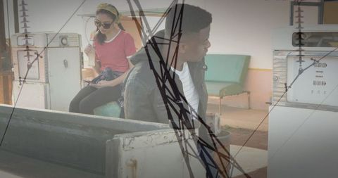 Young Travelers at Retro Gas Station with Tech Overlays