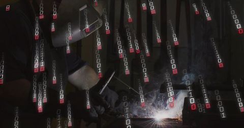 Helmeted welder welding steel with binary data overlay, sparks and industrial arc