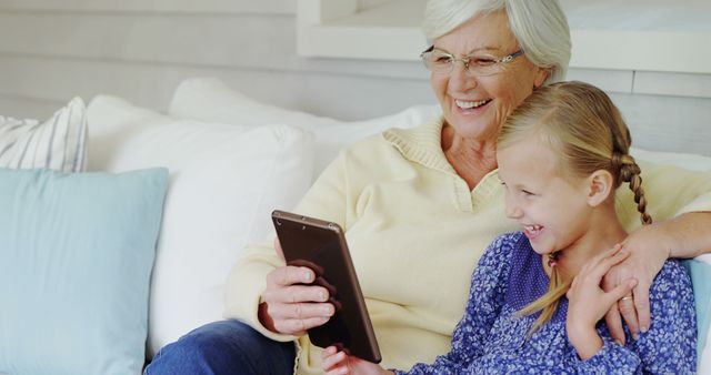 Grandmother and Granddaughter Bonding Together with Tablet - Download Free Stock Images Pikwizard.com