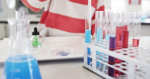 Young Scientist Conducting Experiment in Classroom Laboratory