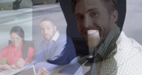 Man Smiling with Laptop and Traveller Superimposed Visual