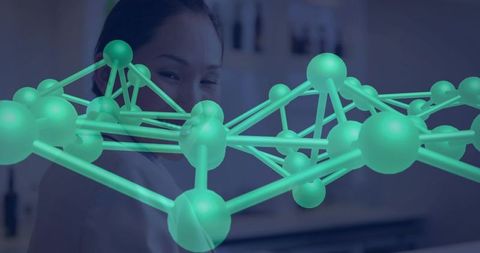 Researcher examining teal molecular lattice hologram in futuristic laboratory environment