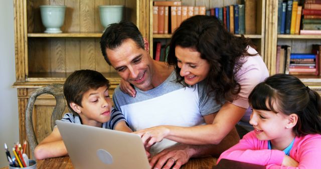 Family Sitting Together Using Laptop at Home - Download Free Stock Images Pikwizard.com