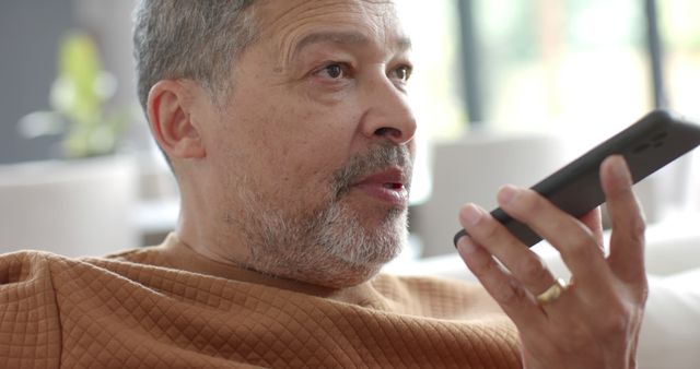 Senior Man Using Voice Assistant on Smartphone at Home - Download Free Stock Images Pikwizard.com