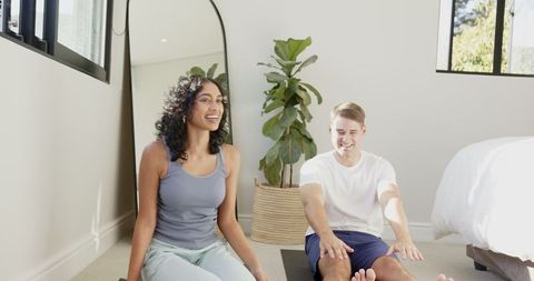 Diverse Couple Engaging in Home Workout for Wellness and Relaxation