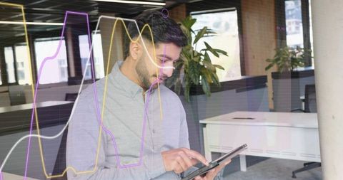 Business analyst tapping tablet visualizing financial line charts and analytics overlay