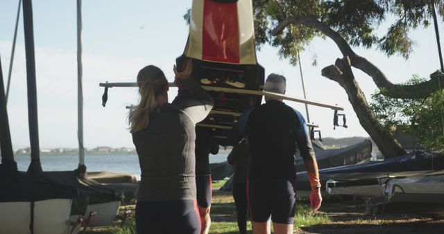 Group of Rowers Carrying Racing Shell to Shore - Download Free Stock Images Pikwizard.com