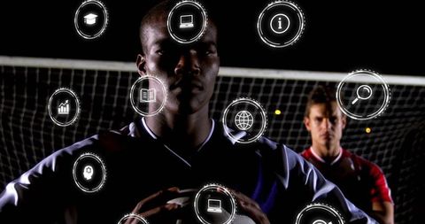 Soccer Players with Digital Interface at Night Game