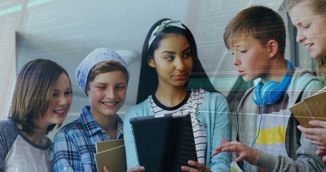 Students engaged in coding with tablet technology in classroom