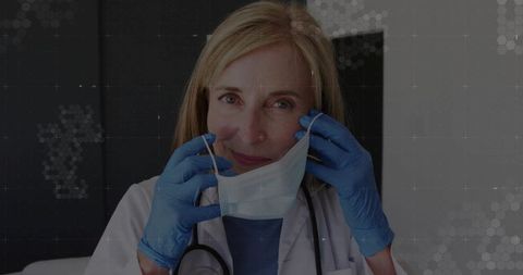 Healthcare Professional Preparing with Surgical Mask and Gloves