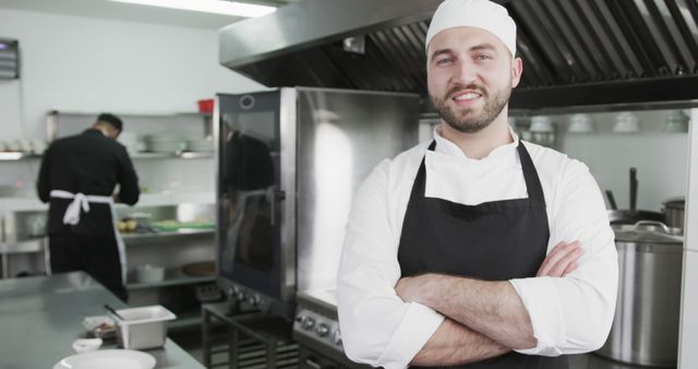 Professional Chef Standing in Modern Kitchen Smiling - Download Free Stock Images Pikwizard.com