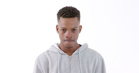 Thoughtful Young Man in Casual Hoodie Against White Background - Download Free Stock Images Pikwizard.com